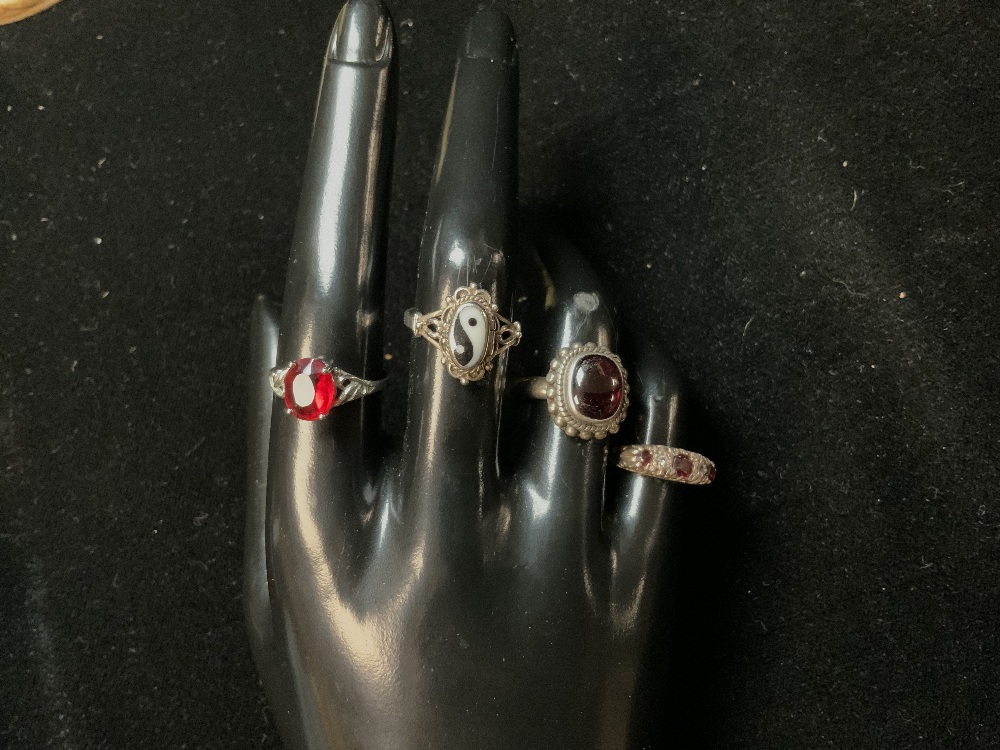 FOUR SILVER DRESS RINGS.