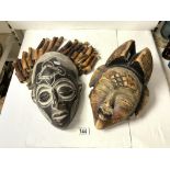 TWO AFRICAN CARVED WOODEN TRIBAL MASKS.