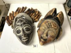 TWO AFRICAN CARVED WOODEN TRIBAL MASKS.