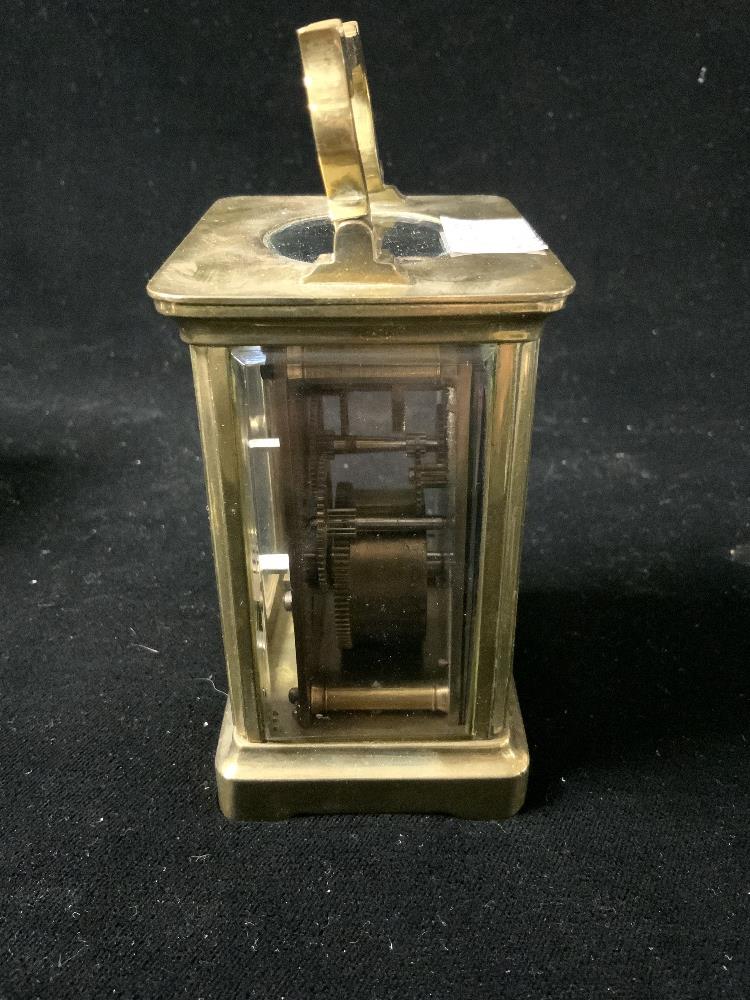 BRASS CARRIAGE CLOCK WITH WHITE ENAMEL DIAL; 11CM WITH A LEATHER OUTER CASE AND KEY - Image 3 of 5