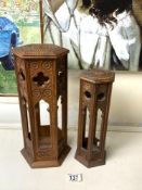 TWO CARVED SOFTWOOD HEXAGONAL MOORISH STANDS; 33CMS.