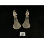 A PAIR OF EDWARDIAN HALLMARKED SILVER MOUNTED CUT GLASS CONICAL SHAPED SCENT BOTTLES AND STOPPERS;
