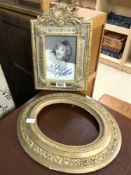 A MIRRORED GILT CUSHION PHOTO FRAME WITH A SIGNED PHOTO OF JOAN COLLINS [ NO PROVENANCE ], AND