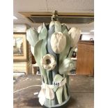 A CERAMIC TABLE LAMP IN THE FORM OF A BUNCH OF FLOWERS; 42 CMS.