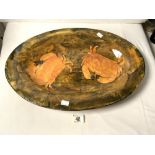 A LARGE OVAL GLAZED CRAB DECORATED DISH; 55X38 CMS.