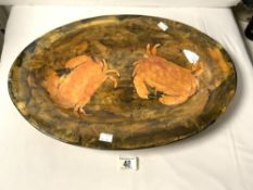 A LARGE OVAL GLAZED CRAB DECORATED DISH; 55X38 CMS.