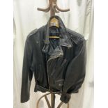 A BLACK LEATHER BIKERS JACKET BY LESCO LEATHERS; SIZE 44.