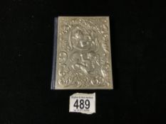 A NEW TESTAMENT BIBLE WITH A HALLMARKED SILVER CHERUB EMBOSSED FRONT COVER.