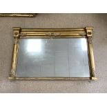 A REGENCY GILT FRAMED OVERMANTLE MIRROR WITH COLUMN AND GESSO MOUNTS; 144X90 CMS.