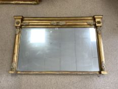 A REGENCY GILT FRAMED OVERMANTLE MIRROR WITH COLUMN AND GESSO MOUNTS; 144X90 CMS.