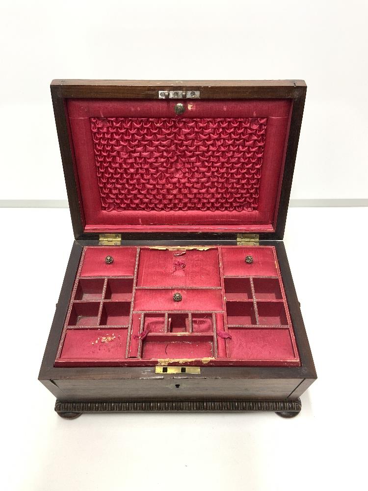 REGENCY ROSEWOOD AND BRASS INLAID SARCOPHAGUS SHAPED JEWELLERY BOX WITH GADROONED BORDERS,THE PINK