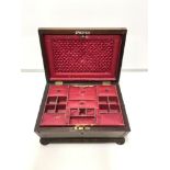 REGENCY ROSEWOOD AND BRASS INLAID SARCOPHAGUS SHAPED JEWELLERY BOX WITH GADROONED BORDERS,THE PINK