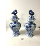 A PAIR OF 20TH CENTURY BLUE AND WHITE DUTCH DELFT VASES AND COVERS, DECORATED WITH FIGURE ON MULE,