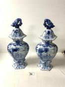 A PAIR OF 20TH CENTURY BLUE AND WHITE DUTCH DELFT VASES AND COVERS, DECORATED WITH FIGURE ON MULE,