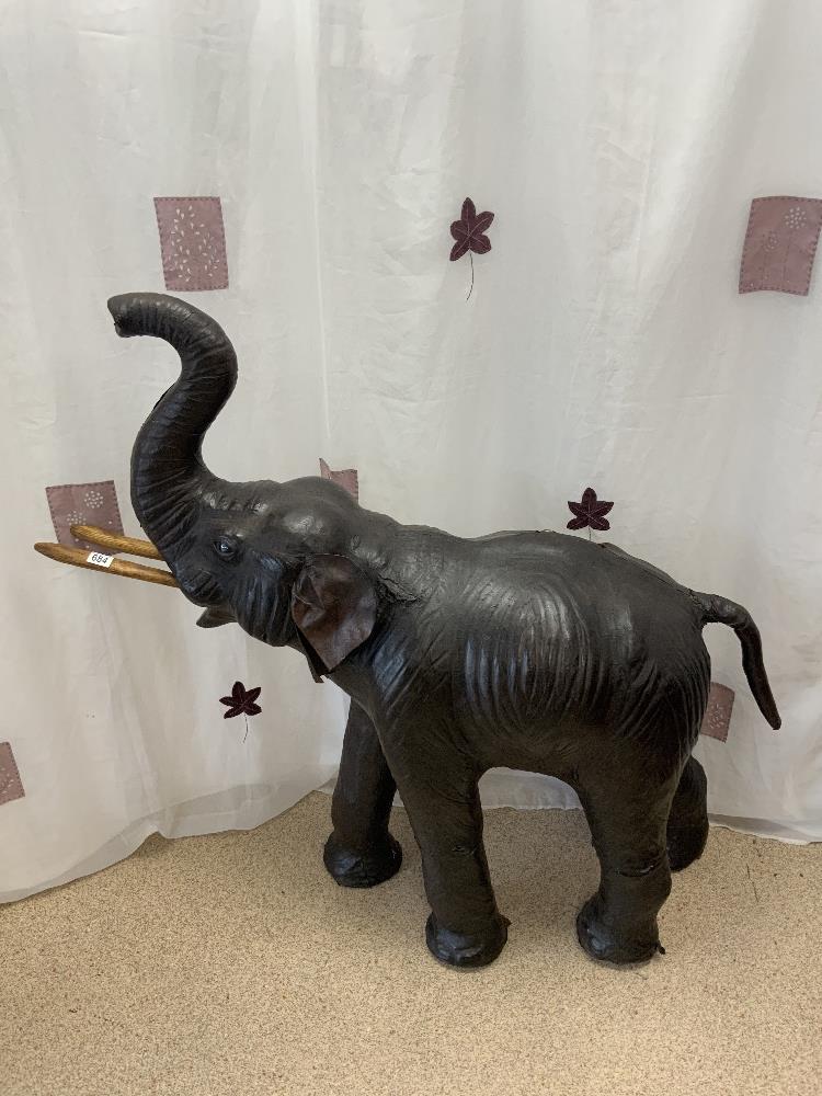 A LARGE LEATHER DISPLAY MODEL ELEPHANT IN THE MANNER OF LIBERTY, 128X130 CMS.