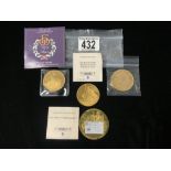 THREE GOLD PLATED COMMEMORATIVE COINS.