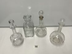 FOUR GLASS DECANTERS ONE BACCARAT AND ONE WITH A HALLMARKED SILVER COLLAR