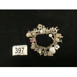 HALLMARKED SILVER CHARM BRACELET WITH CHARMS