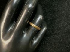 A 22CT GOLD HALLMARKED WEDDING BAND, SIZE K AND HALF, 3 GRAMS.