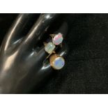 A 750 STAMPED GOLD OPAL SIGNET RING, SIZE J, 6.3 GMS, A 9CT GOLD OPAL SET RING, AND ANOTHER YELLOW