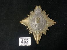 A LARGE BRASS 2ND COUNTY OF LONDON ARMY BADGE.