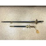 A REPRODUCTION NAVAL OFFICER'S SWORD WITH ENGRAVED BLADE AND REPTILE SKIN, BRASS LION HANDLE, AND