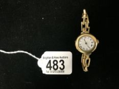 18 CARAT GOLD LADIES SWISS MADE 1920'S WATCH WITH A FLEXI STRAP.