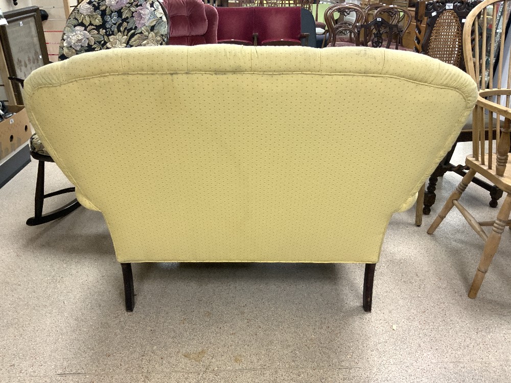 YELLOW TWO SEATER BUTTON BACK SOFA ON BRASS CASTORS 15CM - Image 3 of 3