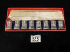 A SET OF EIGHT CARTIER STERLING SILVER PEPPERS IN ORIGINAL FITTED BOX.