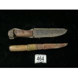 TWO WOODEN HANDLED FISHING KNIVES IN LEATHER SCABBARDS.