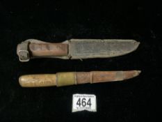TWO WOODEN HANDLED FISHING KNIVES IN LEATHER SCABBARDS.