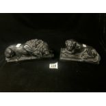TWO BLACK EBONISED RESIN MODELS OF RECUMBENT LION AND LIONESS; 26X10 CMS.