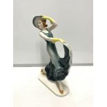 A 1950s CERAMIC FIGURE OF A LADY, 30 CMS.