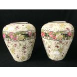 A PAIR OF LATE VICTORIAN TRANSFER PRINTED FLORAL VASES; 21 CMS.