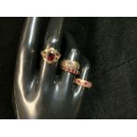 A YELLOW METAL RING STAMPED 18, SET WITH 3 RUBIES, 2.9 GMS, AND 3 THREE 9CT GOLD DRESS RINGS 5.7