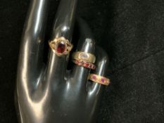 A YELLOW METAL RING STAMPED 18, SET WITH 3 RUBIES, 2.9 GMS, AND 3 THREE 9CT GOLD DRESS RINGS 5.7