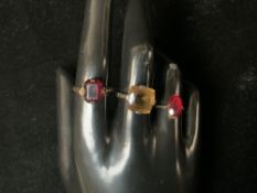 TWO 9CT STONE SET RINGS, AND ANOTHER UNMARKED.