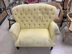 YELLOW TWO SEATER BUTTON BACK SOFA ON BRASS CASTORS 15CM