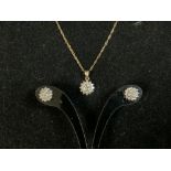 A 375 HALLMARKED GOLD DIAMOND SET PENDANT ON CHAIN AND PAIR OF MATCHING EARRINGS.