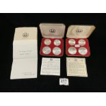 TWO OLYMPIC SERIES SILVER COIN SETS IN CASES, EACH CASE HAS TWO 10 AND TWO 5 DOLLAR COINS.