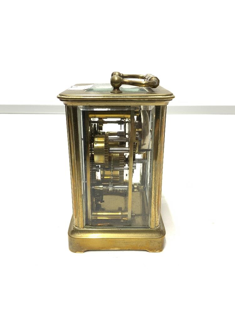 BRASS CARRIAGE CLOCK WITH STRIKING ALARM MOVEMENT AND WHITE ENAMEL DIAL 11CM ( REAR DOOR LOOSE ) - Image 3 of 5