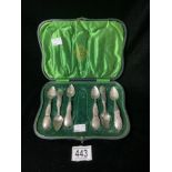 A SET OF SIX EASTERN ENGRAVED WHITE METAL TEA SPOONS, (MARKED RIO) WITH UNASSOCIATED CASE.