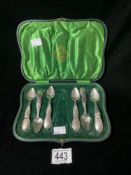 A SET OF SIX EASTERN ENGRAVED WHITE METAL TEA SPOONS, (MARKED RIO) WITH UNASSOCIATED CASE.