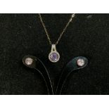 A 375 HALLMARKED GOLD DIAMOND AND AMYTHEST SET PENDANT ON CHAIN AND PAIR OF EARRINGS.