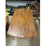 ERCOL DROP LEAF DINING TABLE ON SQUARE TAPER LEGS.