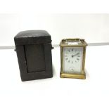 BRASS CARRIAGE CLOCK WITH STRIKING ALARM MOVEMENT AND WHITE ENAMEL DIAL 11CM ( REAR DOOR LOOSE )