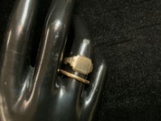 A 22CT HALLMARKED WEDDING BAND; SIZE N; 2.6 GMS AND A 375 HALLMARKED SIGNET RING; SIZE N; 2.5 GMS.