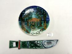 A POOLE STUDIO POTTERY PLATE WITH FIGURES WALKING ON A PATH DECORATION; 20.5 CMS AND A POOLE POTTERY