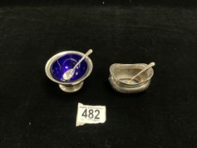 TWO HALLMARKED SILVER SALTS WITH SPOONS; 1 WITH BLUE GLASS LINER; 74 GMS.