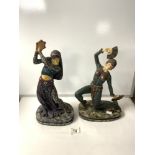 PAIR OF ART DECO STYLE COMPOSITION FIGURES OF EXOTIC DANCERS ON OVAL SIMULATED MARBLE PLINTHS;